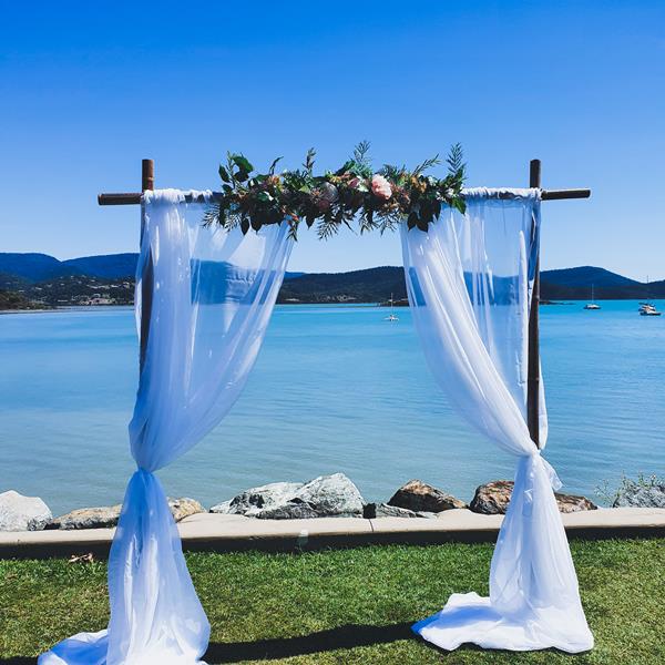 2 Post Bamboo Arbour, Sheer Draping, Real Touch Floral Arrangement